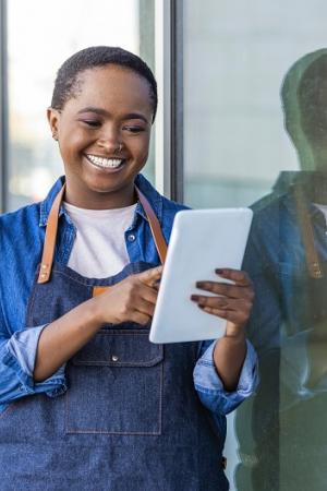 female black entrepreneur holding tablet