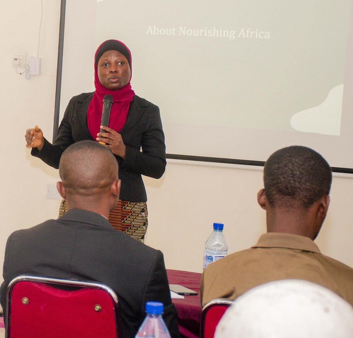 woman presenting on Nourishing Africa